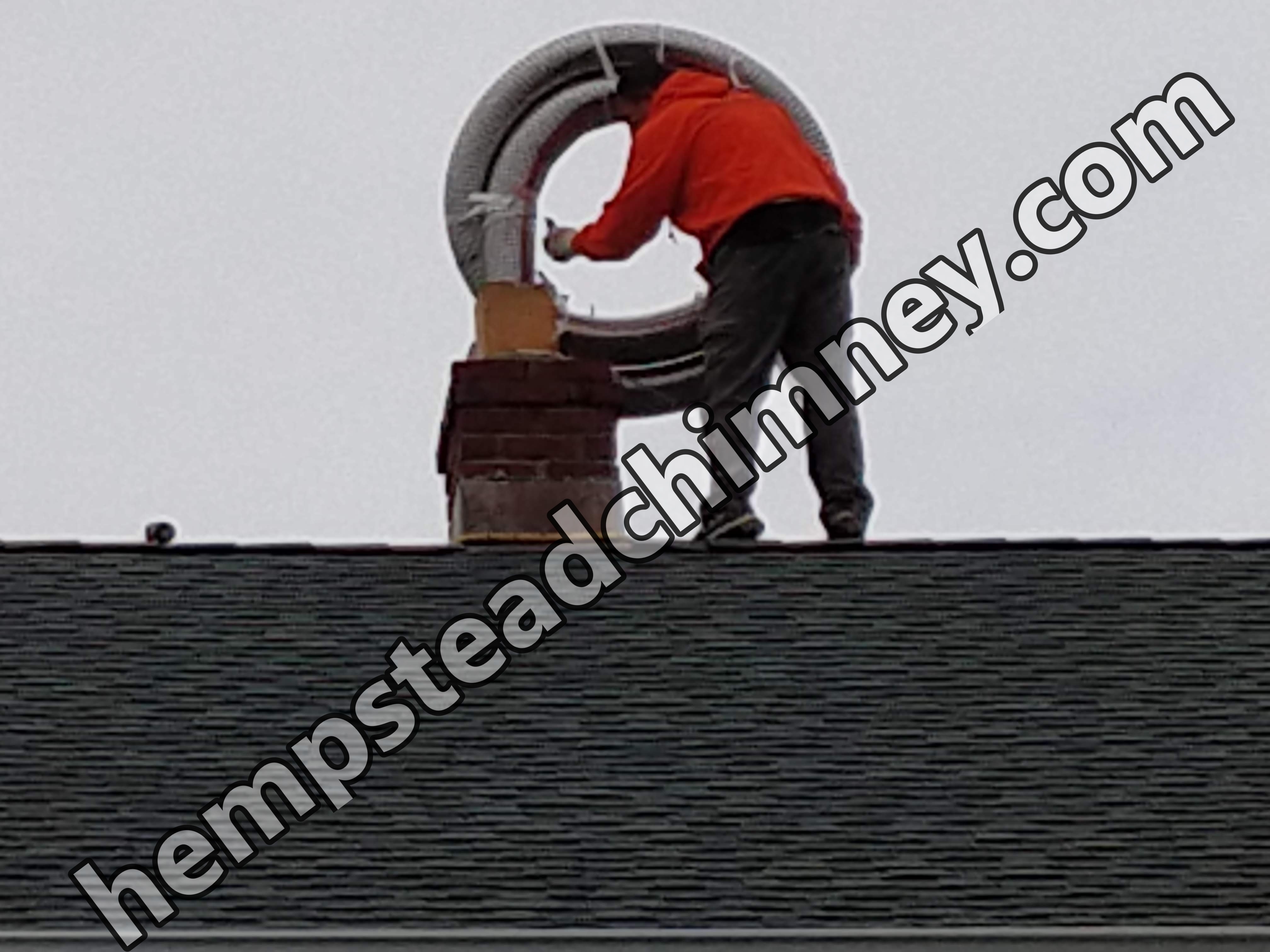 Flexible stainless chimney liner being installed in Hempstead, New York