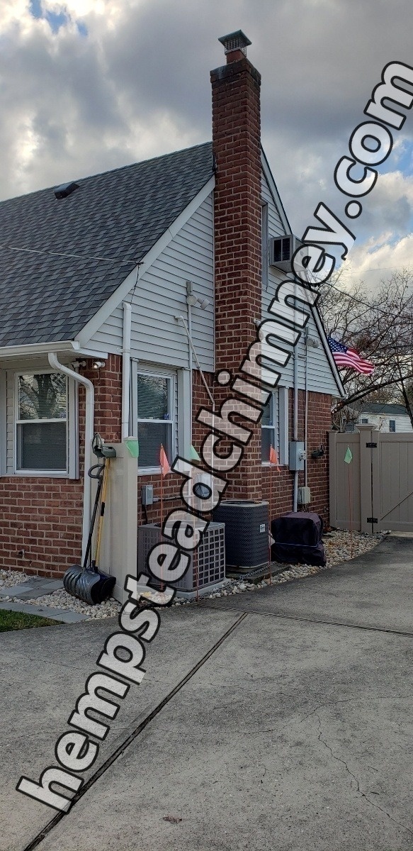 Professional chimney repointing restoring brick joints in Hempstead, NY